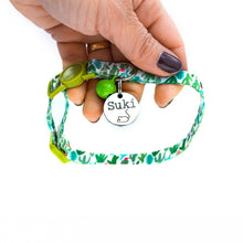 Load image into Gallery viewer, Floral cat collar shown with engraved ID tag attached