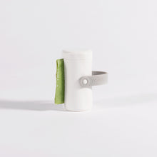 Load image into Gallery viewer, Moestar poop bag holder with green biodegradable waste bags showing compact design and universal clip attachment