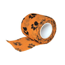 Load image into Gallery viewer, Cohesive bandage 2 inch vet wrap roll in orange with paw-print pattern