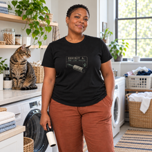 Load image into Gallery viewer, Illustrative lifestyle view of a woman wearing the Exhibit A lint roller T-shirt with a cat