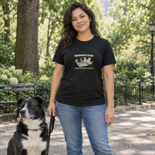 Load image into Gallery viewer, Illustrative lifestyle mockup of a woman outdoors wearing the black Performance Review dog lover T-shirt