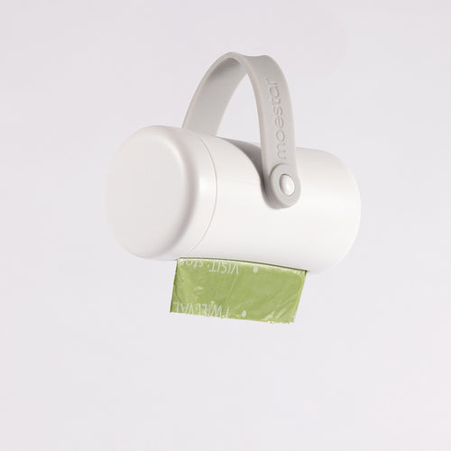 Moestar white dog poop bag holder dispenser with green biodegradable waste bag on white background