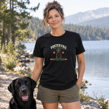 Load image into Gallery viewer, Illustrative woman wearing the Black Foster Fail Social Club Black Lab T-shirt beside a lake with a Black Lab
