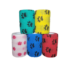 Load image into Gallery viewer, Self-adhering cohesive bandage vet wrap, 3 inch by 5 yard, with paw-print pattern — for dogs and cats

