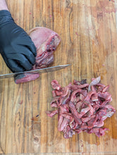 Load image into Gallery viewer, Dog enjoying a freeze-dried beef tongue treat
